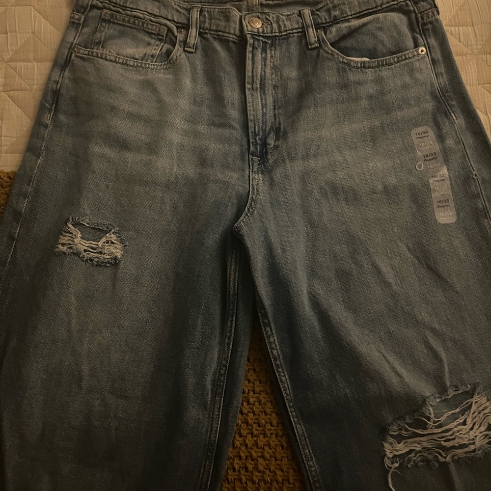 Women’s distressed, wide leg jeans